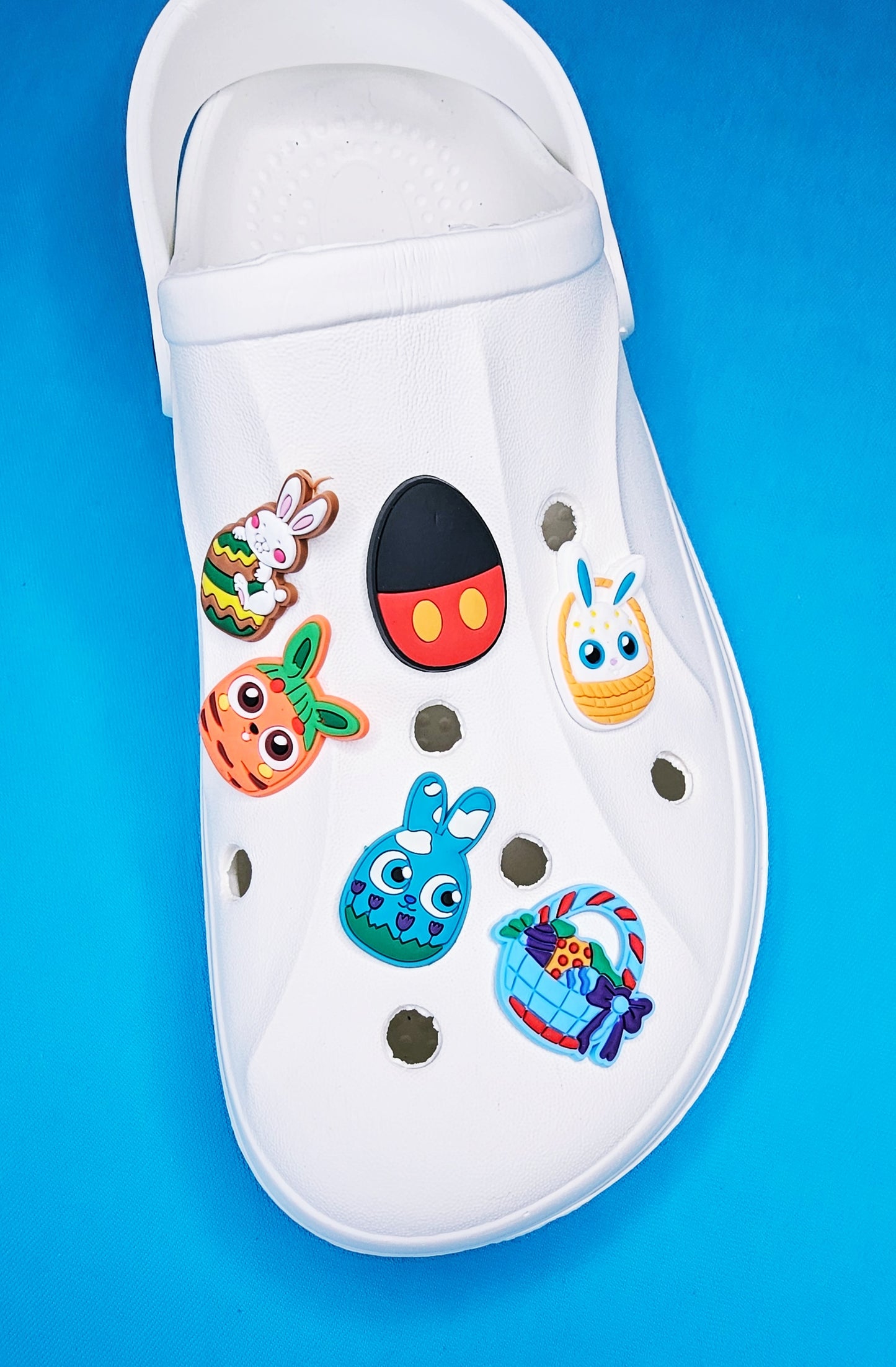 Easter themed croc charms, bunny Easter basket, decorated eggs, Easter chicks cartoon character festive occasion
