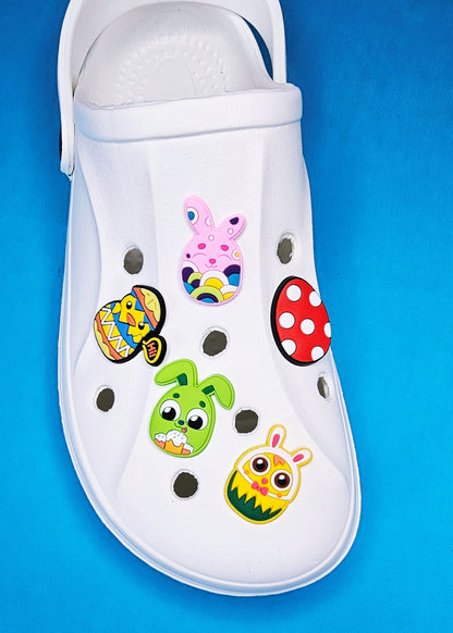 Easter themed croc charms, bunny Easter basket, decorated eggs, Easter chicks cartoon character festive occasion